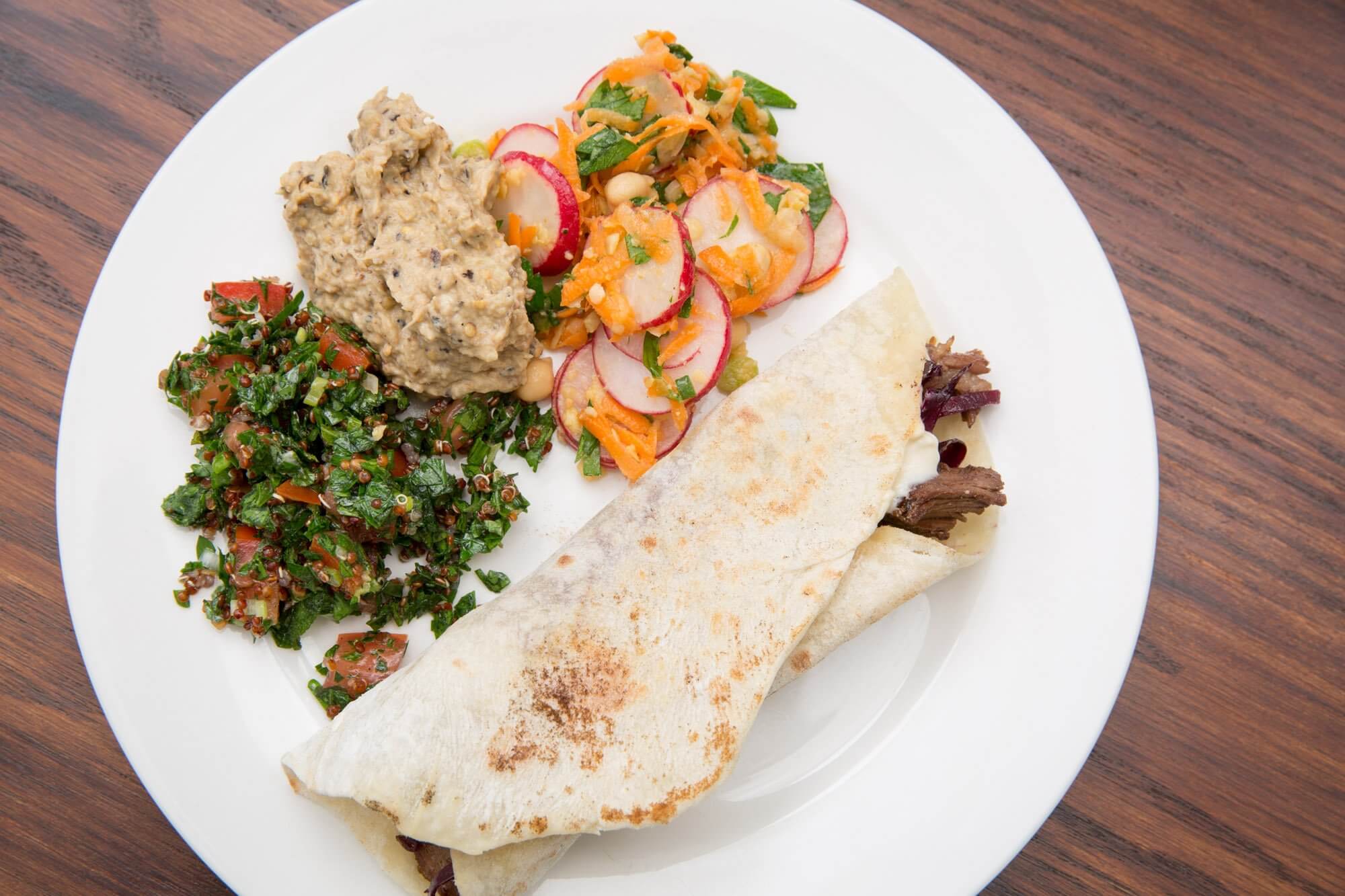 Homemade braised lamb shawarma with tabbouleh, baba ghanouj and chickpea salad