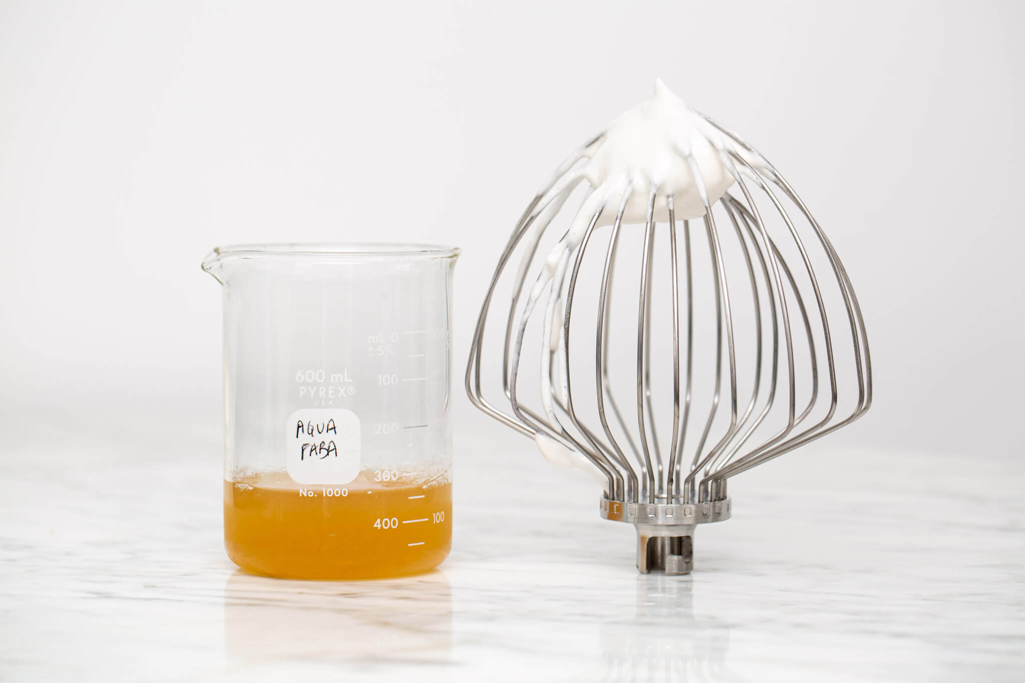 Liquid aquafaba beside whipped aquafaba as a vegan whipped egg white substitute