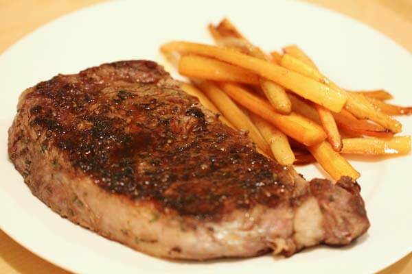 Pan-seared ribeye steak with pan-roasted carrots