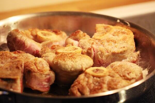 Cooking the veal shanks for osso buco