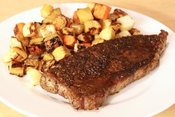 Spice-rubbed New York strip steak with roasted root vegetables