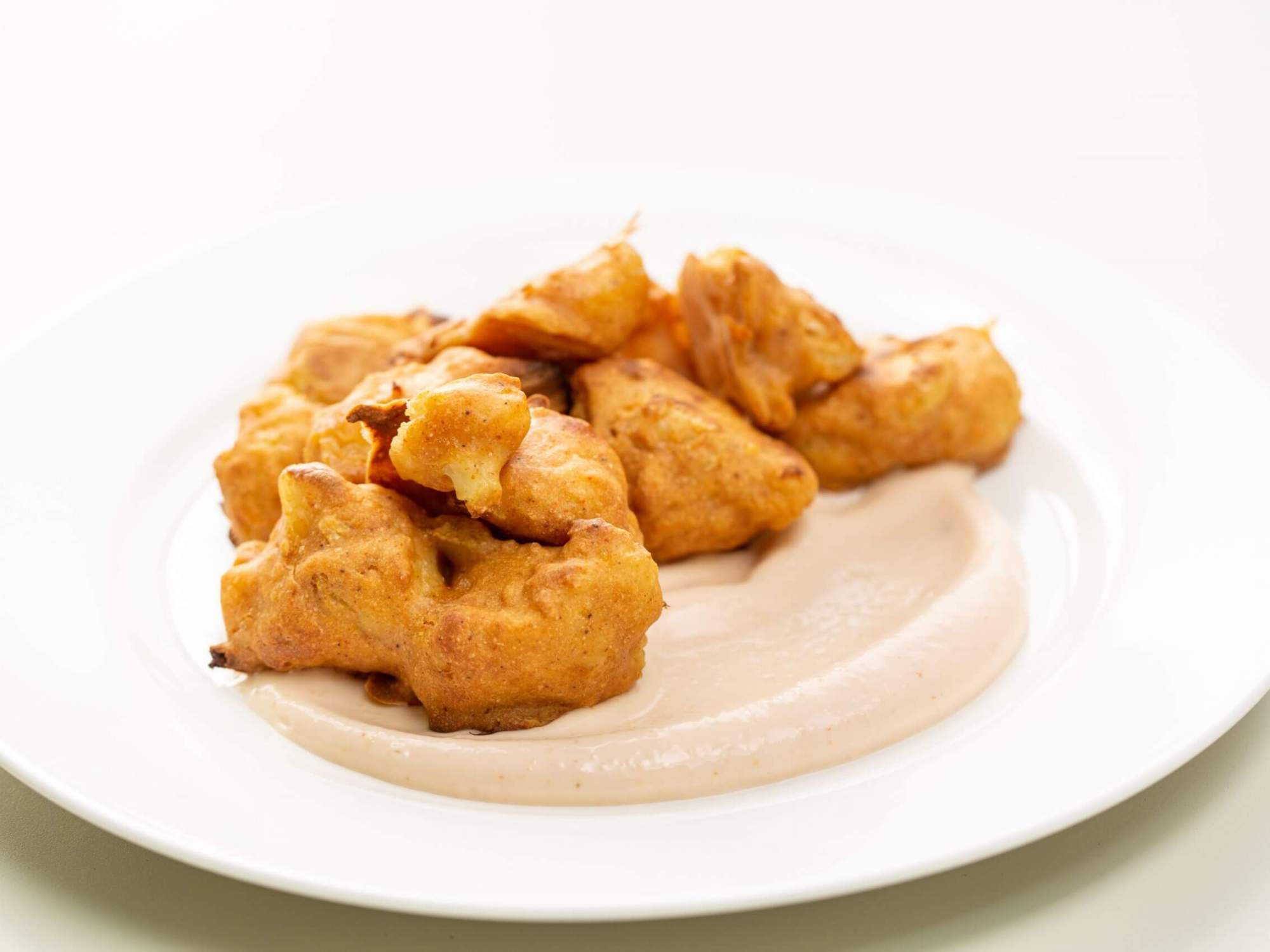 Baked cauliflower wings with a spicy aioli