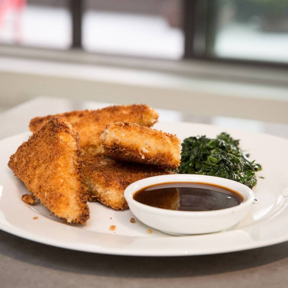 Crispy fried breaded tofu with hoisin dipping sauce and spinach
